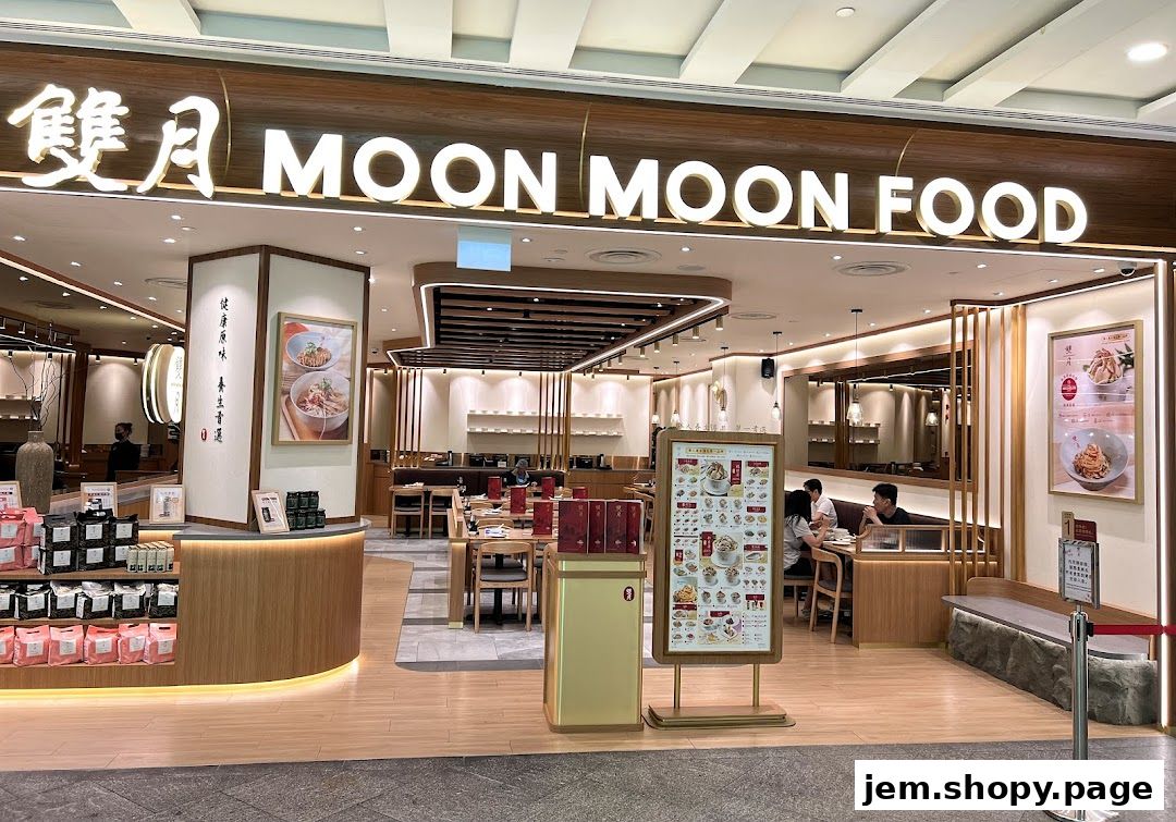 The exterior of Moon Moon Food restaurant with a display menu and seating visible inside.