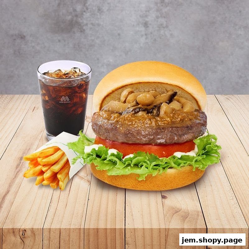 A delicious MOS Burger with fries and a cola drink on a wooden table.