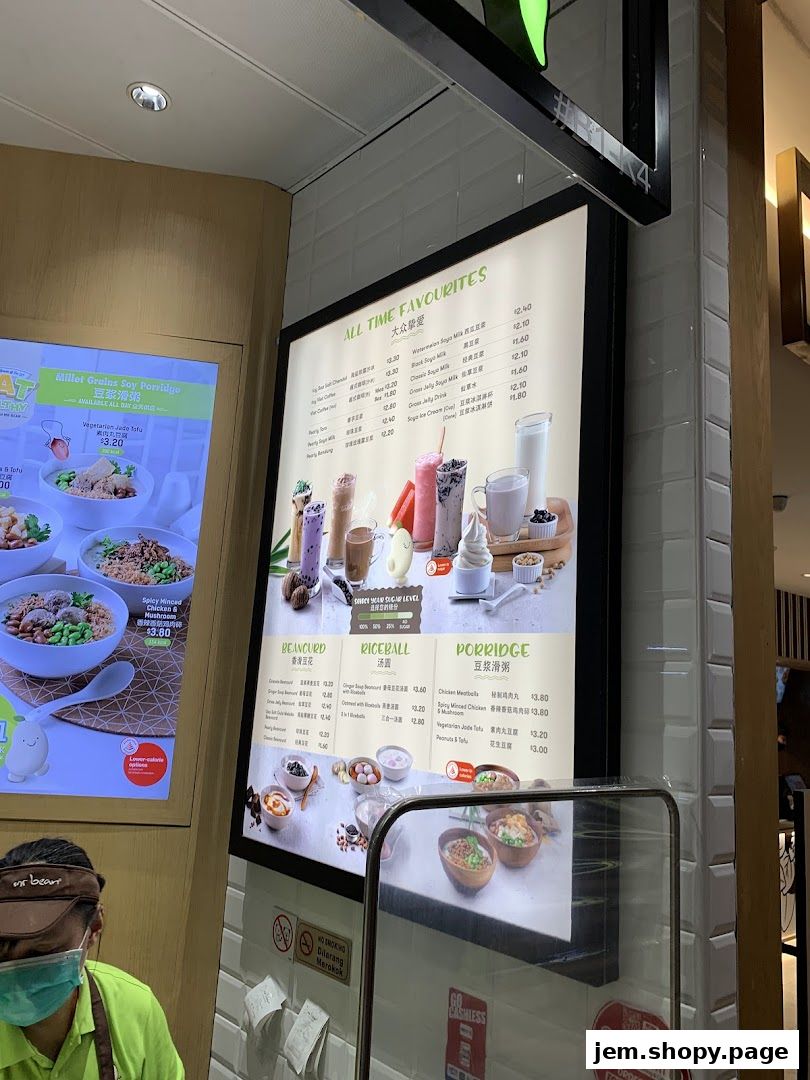 A menu board displays 'All Time Favourites' with various drinks, beancurd, riceballs, and porridge options.