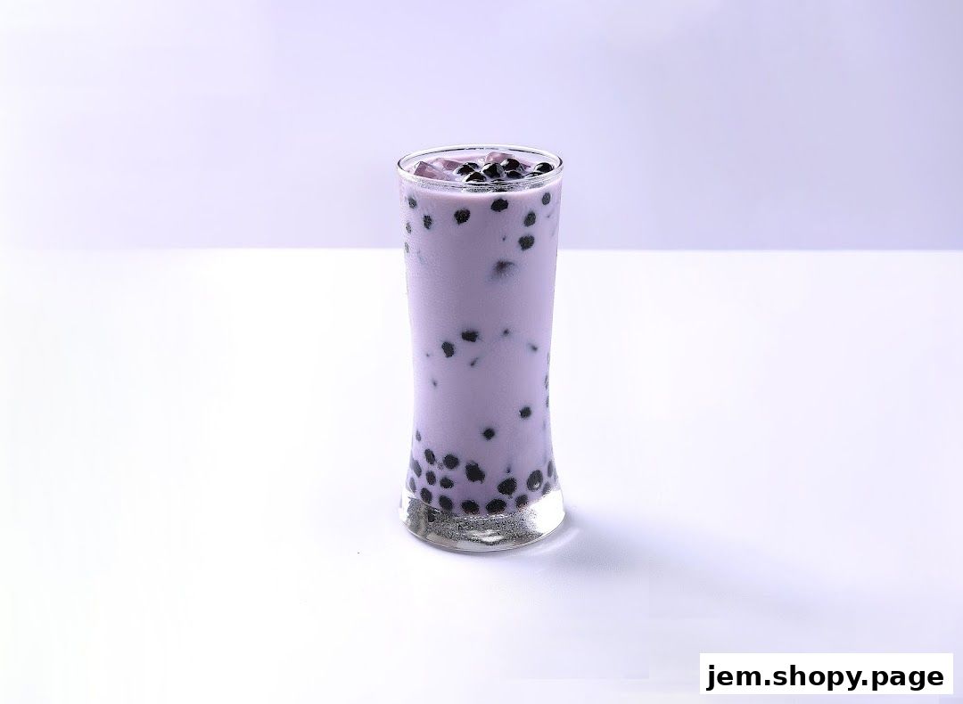 A tall glass of purple taro bubble tea with tapioca pearls and ice.