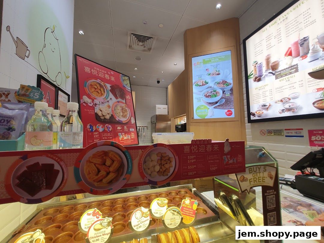 Interior view of a Mr Bean shop with food displays and menus.