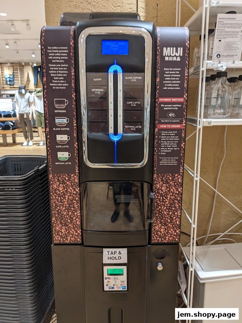 A MUJI coffee machine offering various hot beverages like espresso, black coffee, and matcha latte.
