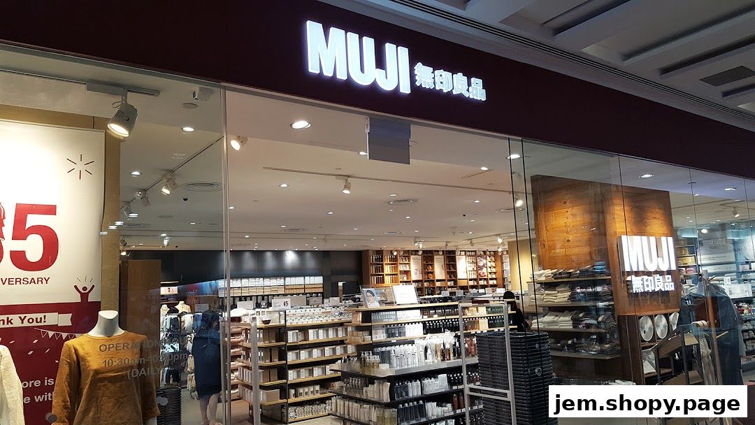 The entrance of a MUJI store showcasing its products and branding.