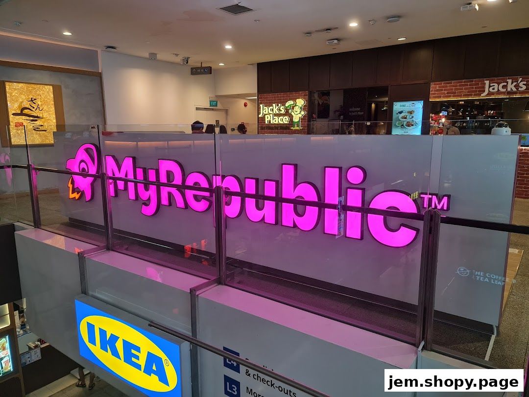 The MyRepublic store front with its prominent pink logo and adjacent shops.