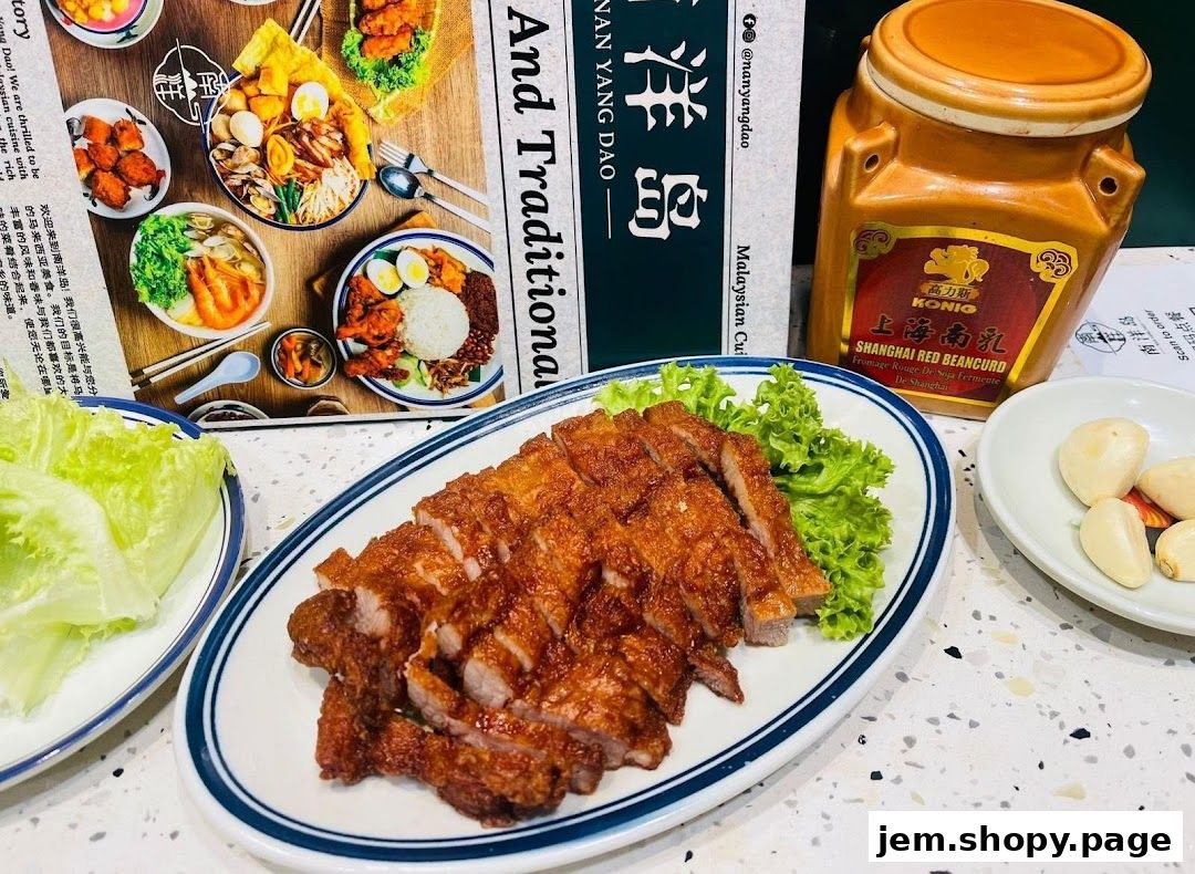 A plate of crispy fried pork slices served with lettuce and garlic, next to a menu and a jar of red bean curd.