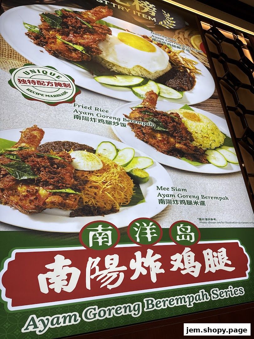 A menu board showcasing Ayam Goreng Berempah dishes like Nasi Lemak, Fried Rice, and Mee Siam.