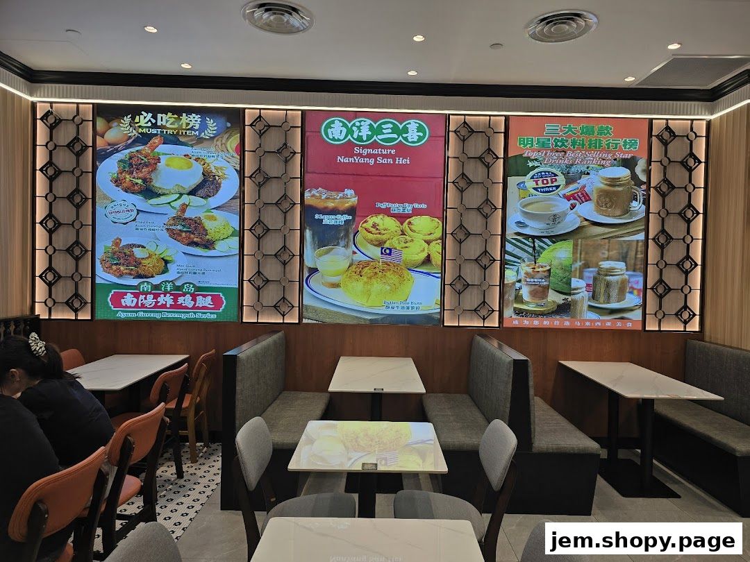 Interior of Nan Yang Dao restaurant with menu displays and seating.