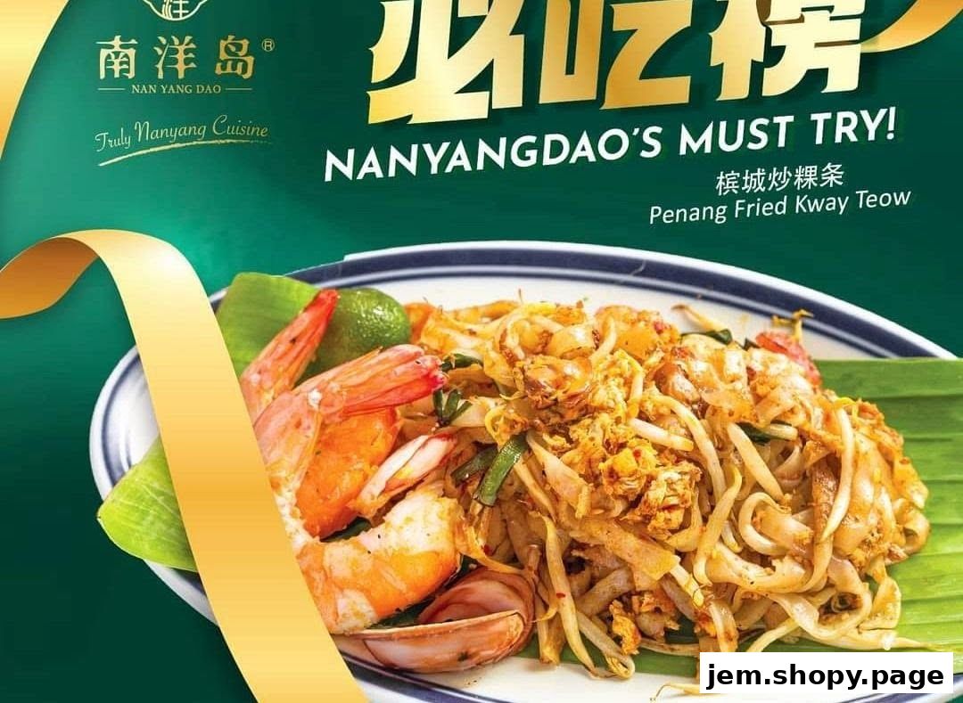 A close-up of Penang Fried Kway Teow with prawns, lime, and banana leaf.