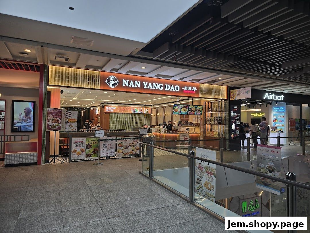 The exterior of Nan Yang Dao restaurant with its prominent signage and display of food items.