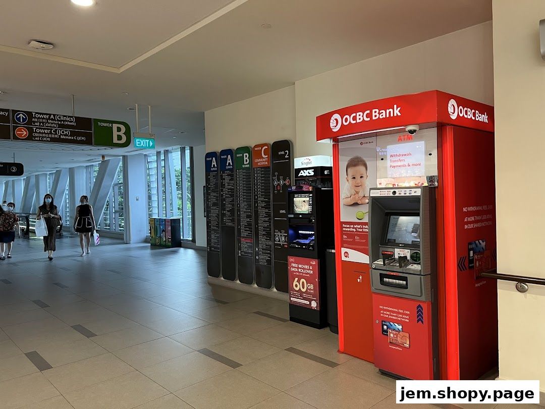 An OCBC Bank ATM machine is prominently displayed in a modern mall walkway.