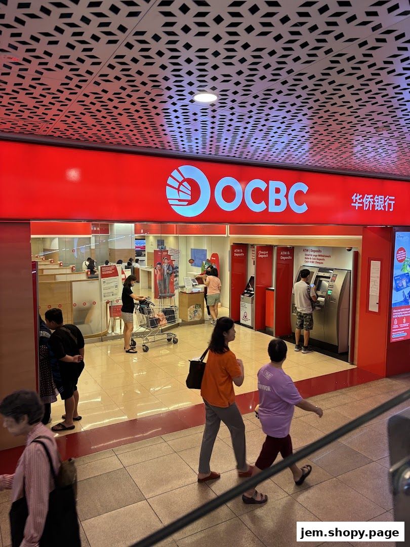 The OCBC Bank branch entrance with ATMs and customers inside.