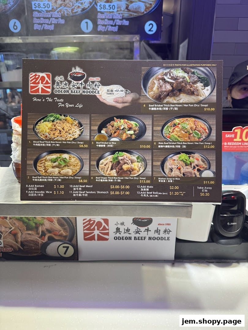 A menu board for Odeon Beef Noodle featuring various noodle and rice dishes with prices.
