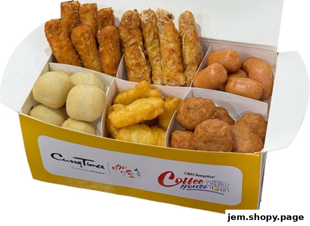 A box filled with various fried snacks including fish balls, sausages, and spring rolls.