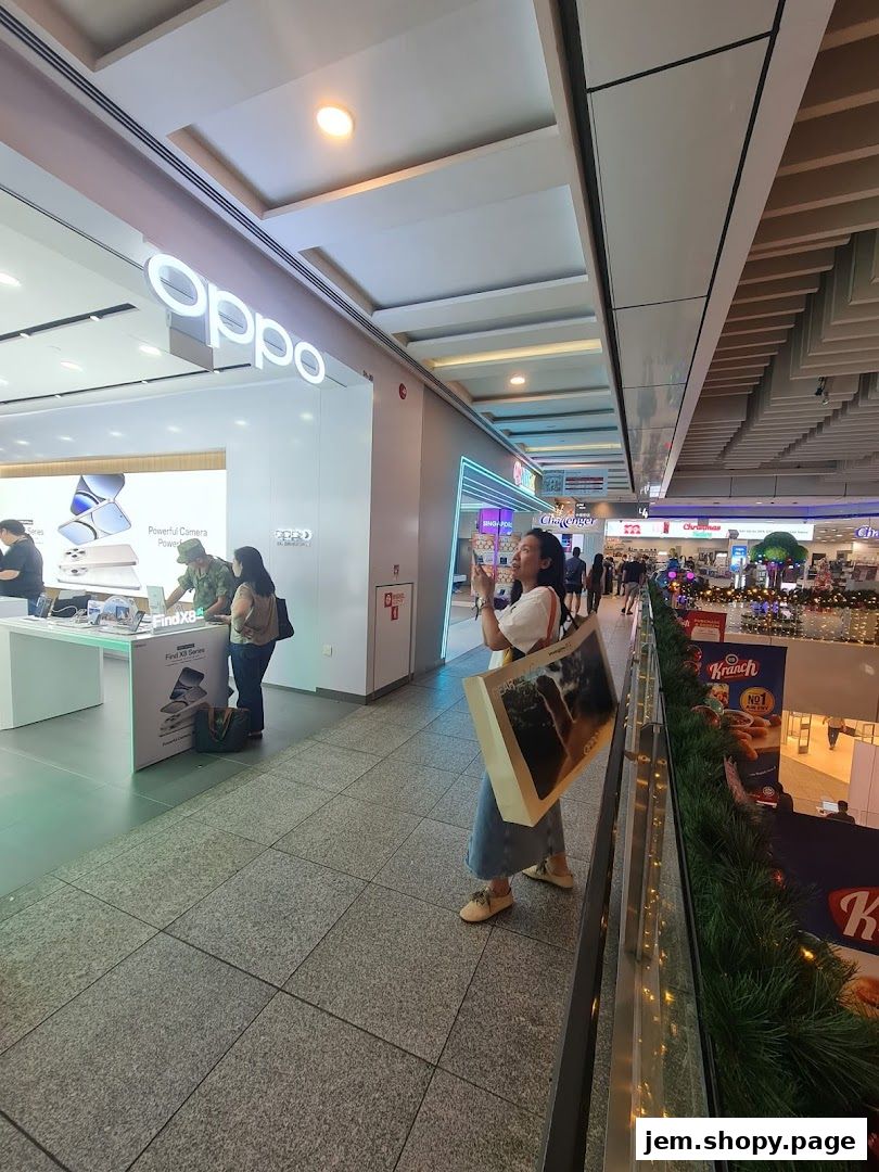 The OPPO Concept Store entrance at JEM Mall, showcasing the latest Find X series phones.