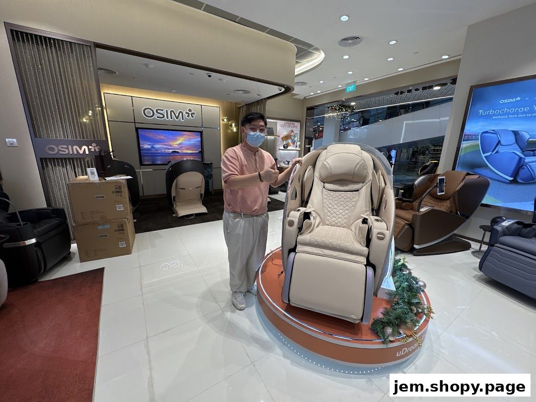 A man stands in an OSIM store showcasing a massage chair.