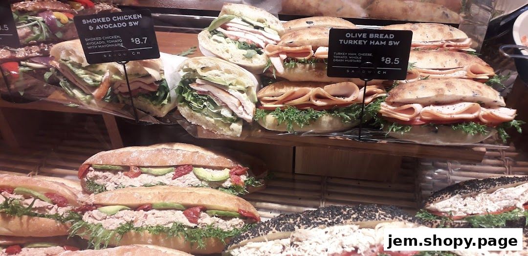 A display of fresh sandwiches with various fillings and bread types.