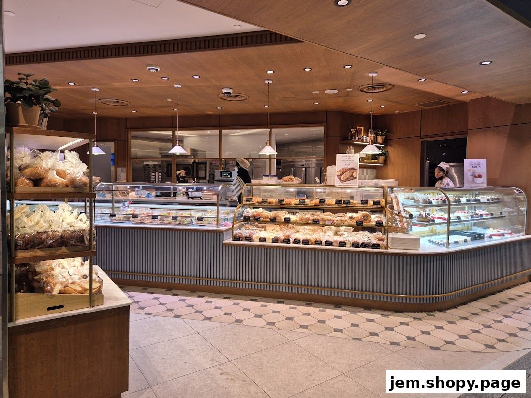 Interior view of a Paris Baguette bakery showcasing a wide selection of pastries and breads.
