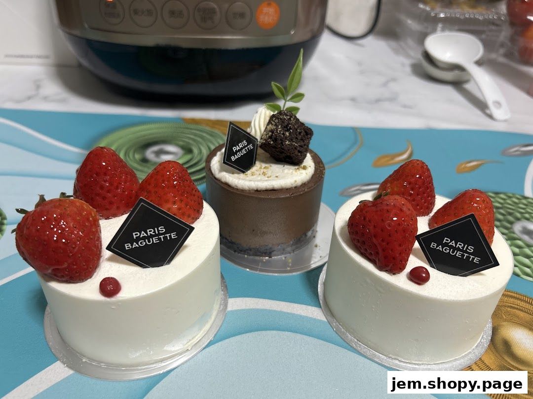 Three delicious cakes from Paris Baguette, two with strawberries and one chocolate.