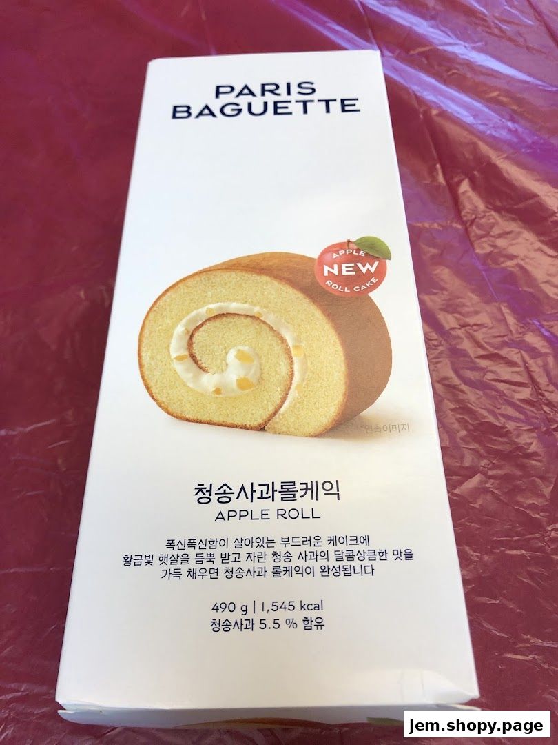 A box of Paris Baguette Apple Roll Cake with a slice of cake shown.