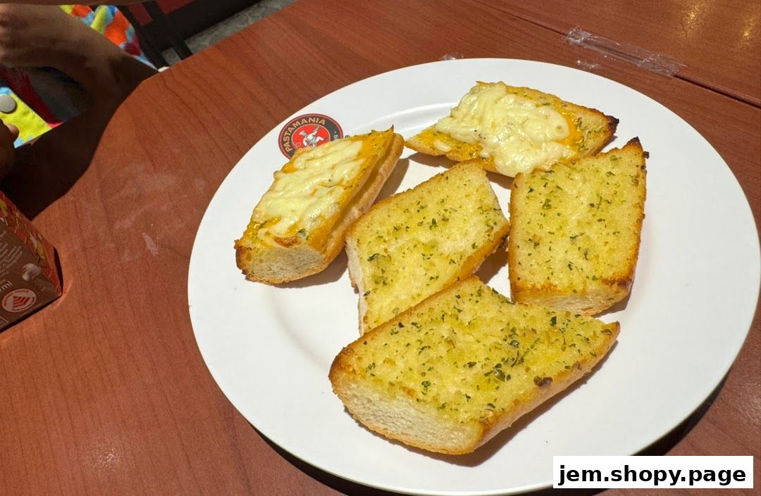 A plate of garlic bread and cheesy garlic bread from PastaMania.
