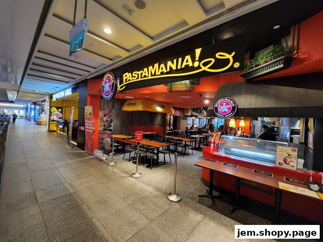 The exterior of PastaMania, an Italian casual dining restaurant, with seating and a counter visible.
