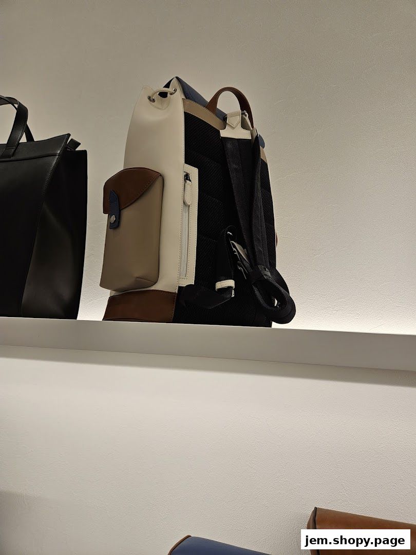 A stylish, multi-colored backpack displayed on a shelf in a retail store.