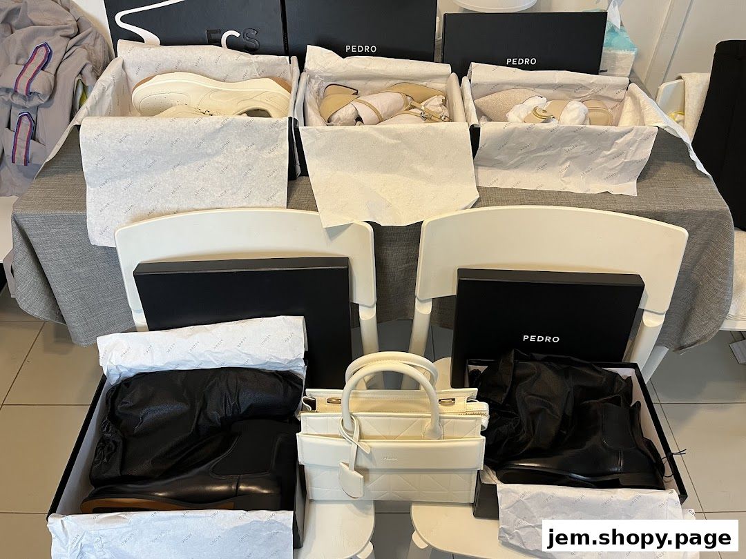 PEDRO Jem shop display of various shoes and a handbag in boxes.