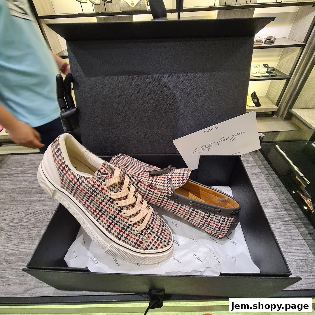 A pair of stylish houndstooth patterned shoes presented in a gift box from PEDRO.