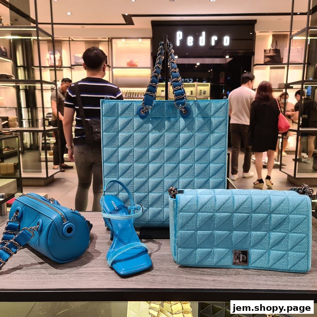 A display of blue quilted handbags and a high-heeled sandal at a Pedro store.