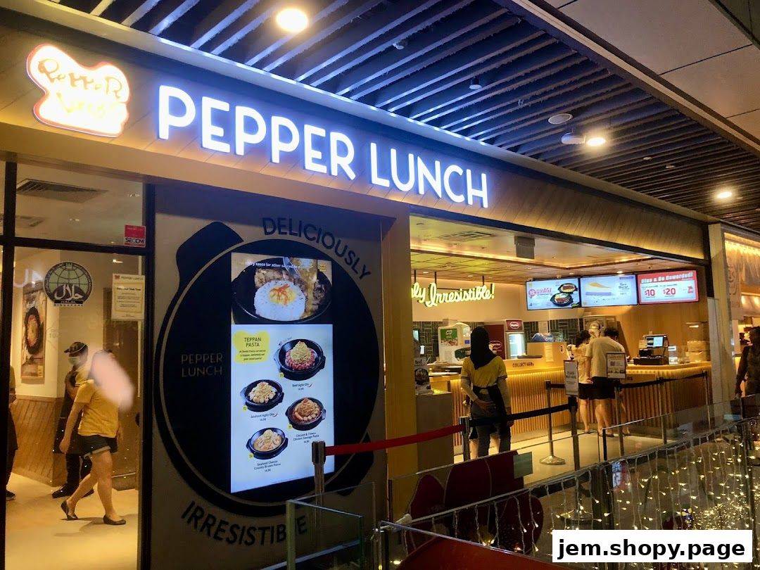 The exterior of a Pepper Lunch restaurant with its prominent signage and menu display.