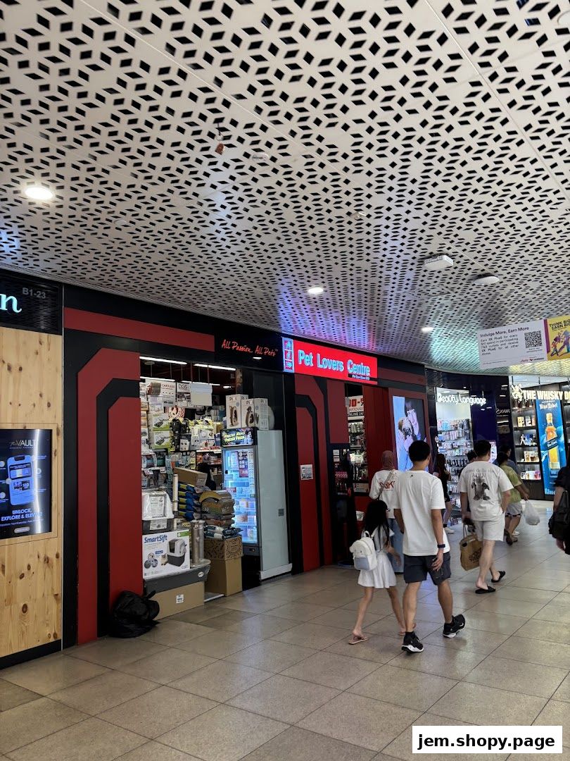 The Pet Lovers Centre shop front with various pet supplies displayed inside and outside.