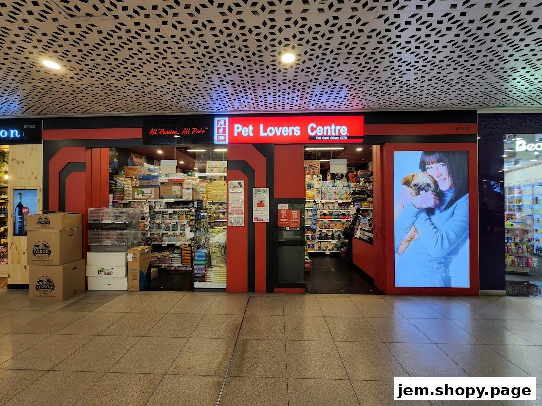 The Pet Lovers Centre shop front with a display of pet supplies and a large advertisement.