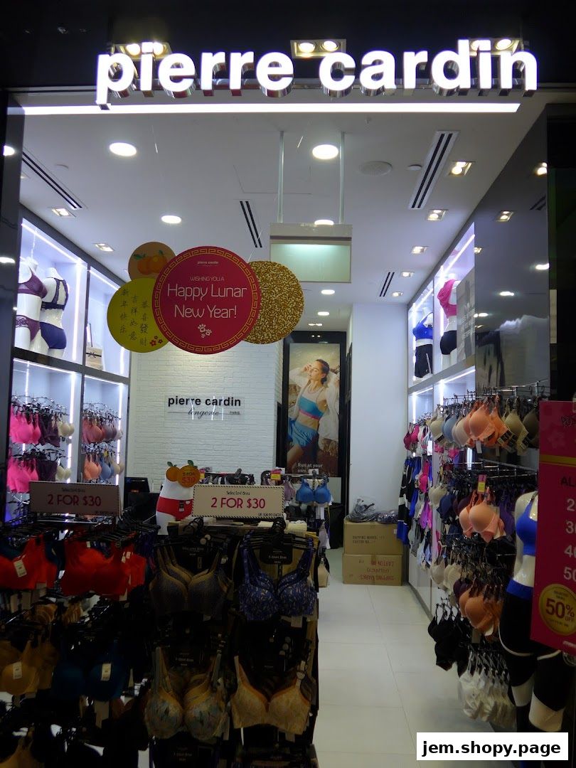 Entrance of a Pierre Cardin Lingerie store displaying various bras and promotional signs.