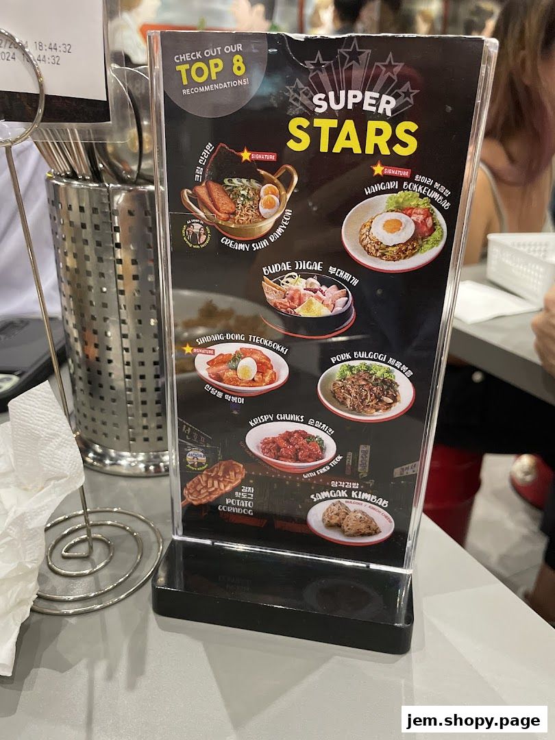 A menu board showcasing "Super Stars" top 8 Korean street food recommendations.