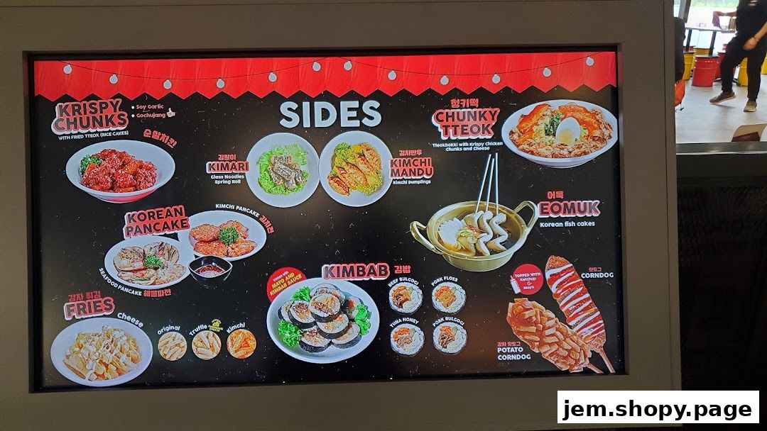 A digital menu board displaying various Korean street food dishes with images and names.