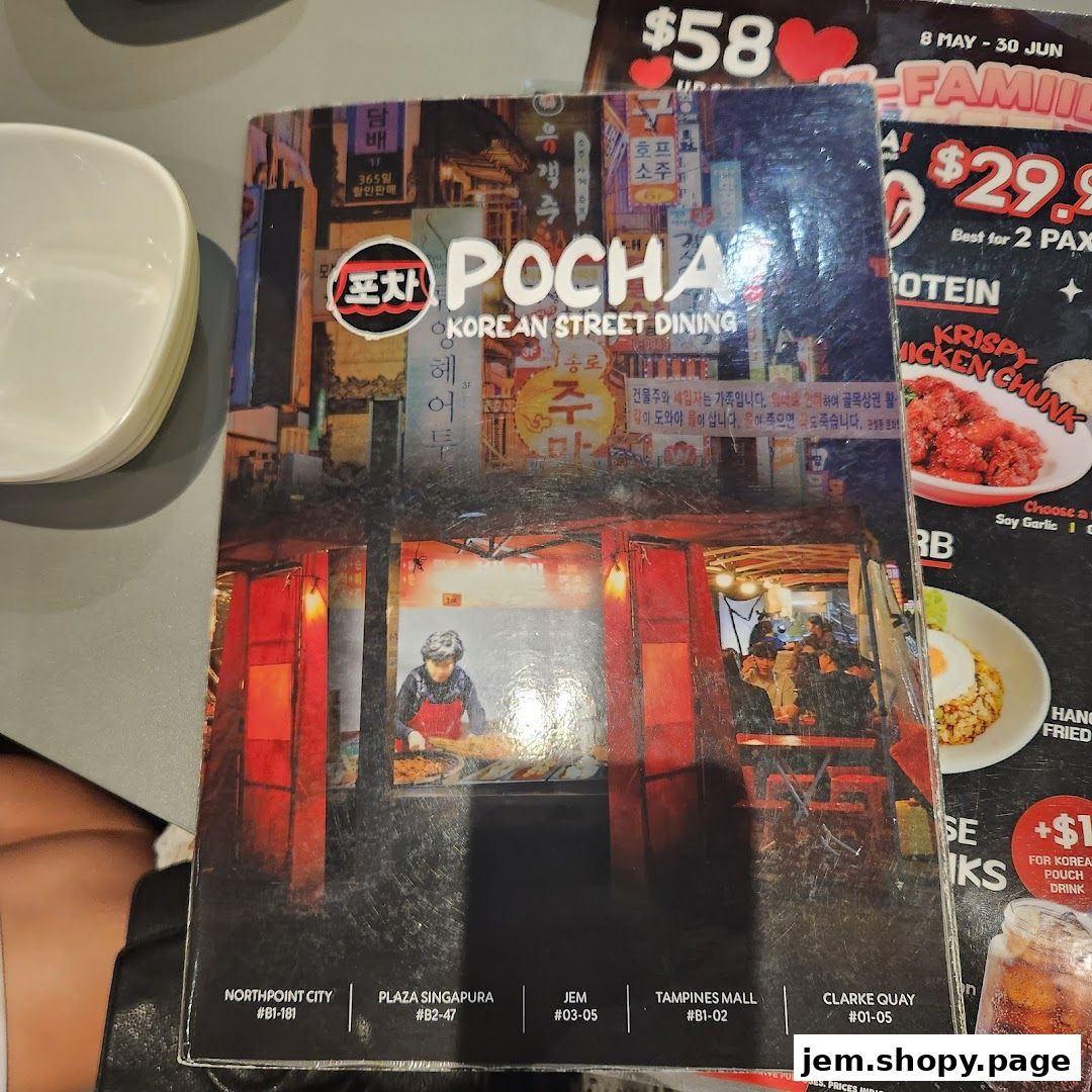 A menu cover for POCHA! Korean Street Dining featuring vibrant street scenes and food.