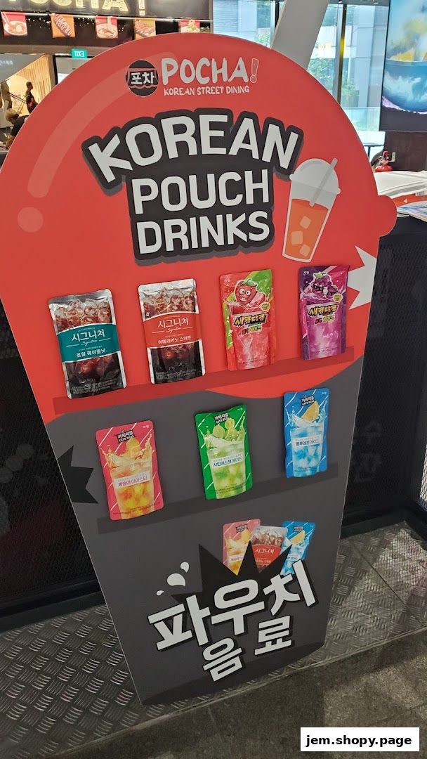 A display board showcasing various Korean pouch drinks from POCHA! Korean Street Dining.