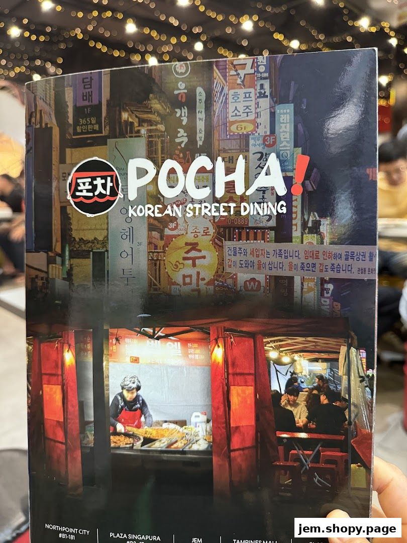 A menu cover for POCHA! Korean Street Dining featuring vibrant street scenes and food stalls.