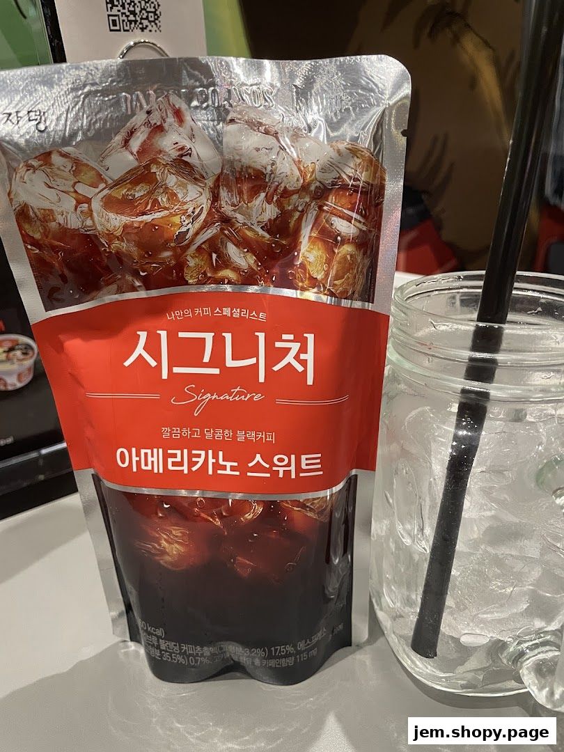 A pouch of signature sweet Americano coffee next to a glass of ice and a straw.