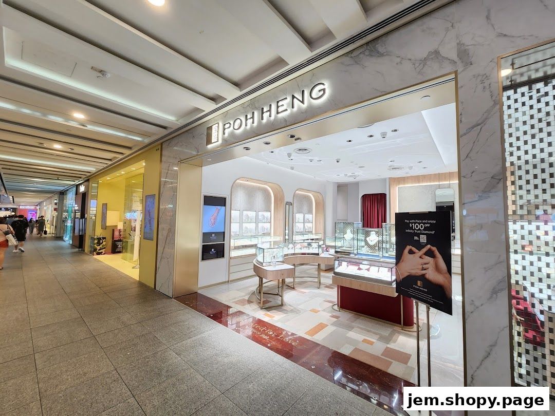 The elegant storefront of Poh Heng Jewellery, showcasing exquisite displays and a promotional sign.
