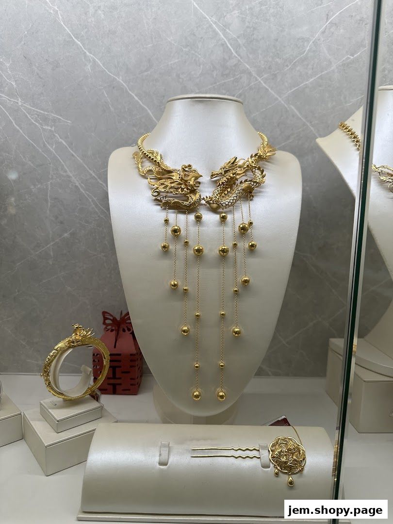 A display of exquisite gold jewelry featuring dragon motifs and dangling beads.