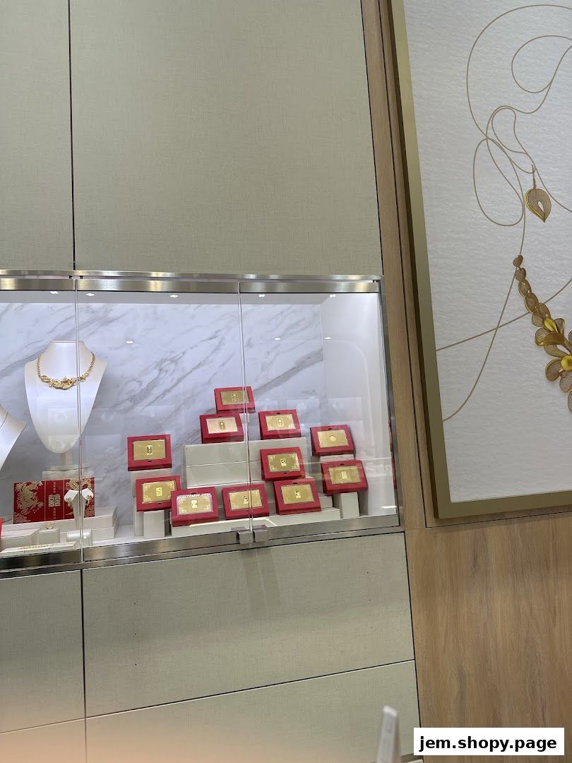A display case filled with gold bars and a necklace at Poh Heng Jewellery.
