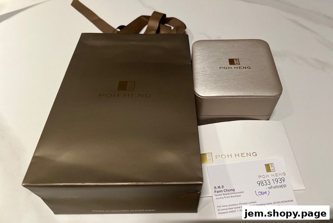 Poh Heng Jewellery shopping bag, ring box, and business card.