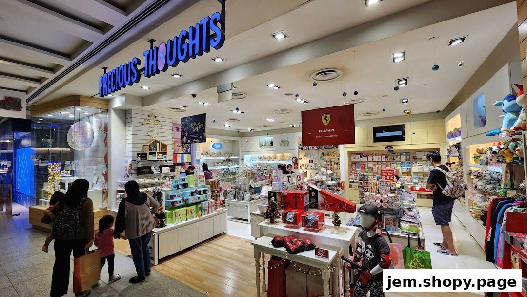 Interior view of Precious Thoughts JEM gift shop with various merchandise and shoppers.