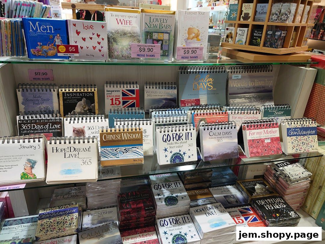 A retail display shelf filled with various inspirational books, calendars, and gift items.