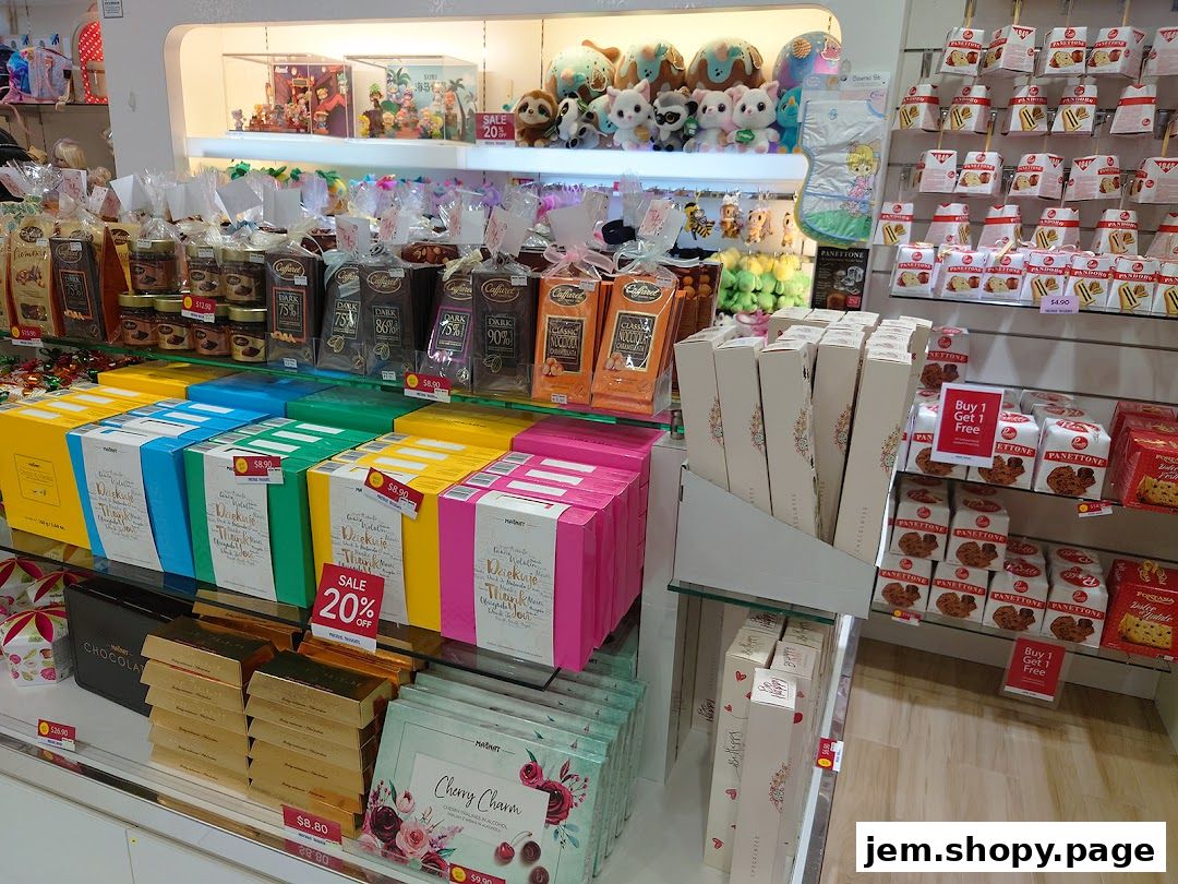 A display of chocolates, panettone, and gift boxes in a retail shop.