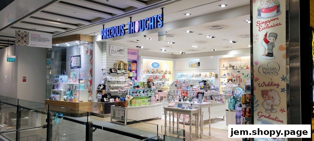 The exterior of the Precious Thoughts JEM shop, showcasing various gift items and figurines.