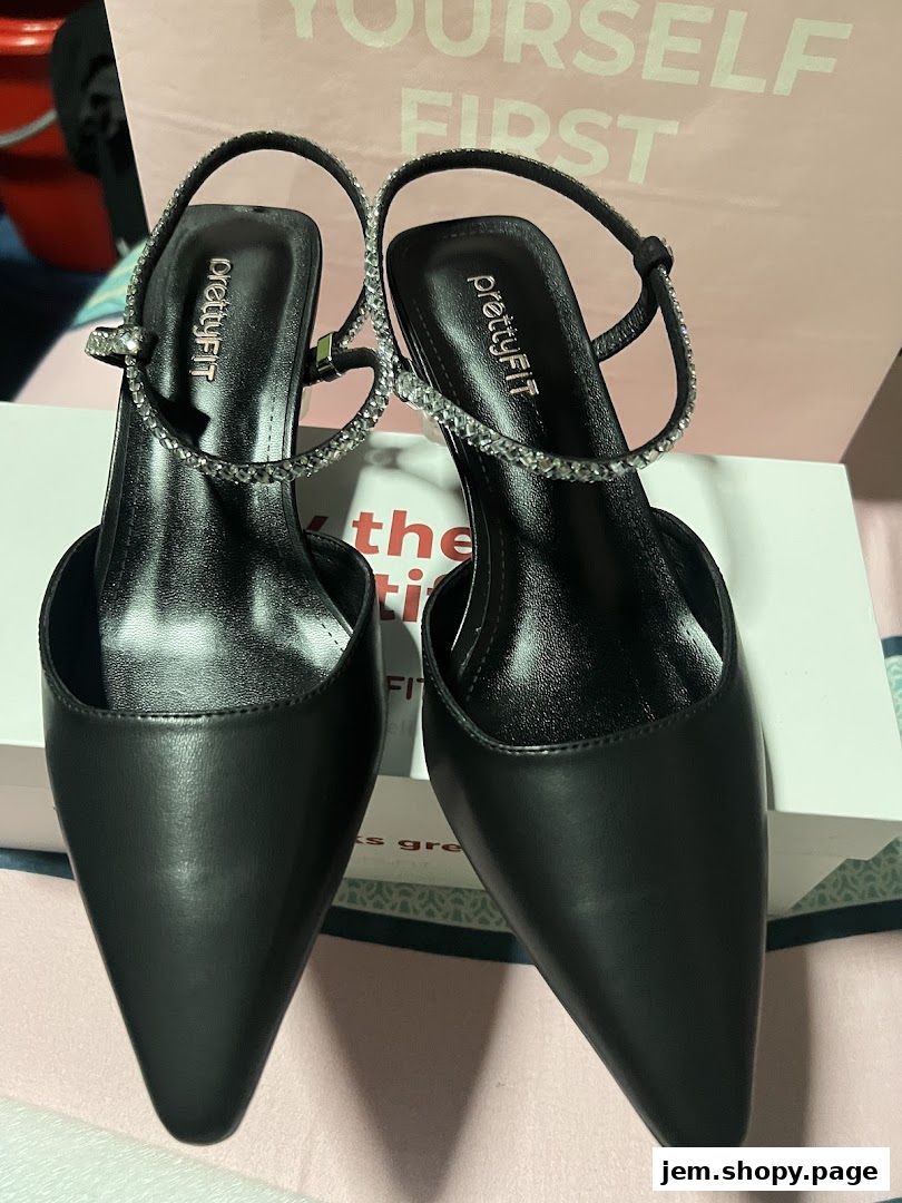 A pair of black pointed-toe heels with rhinestone straps from prettyFIT.