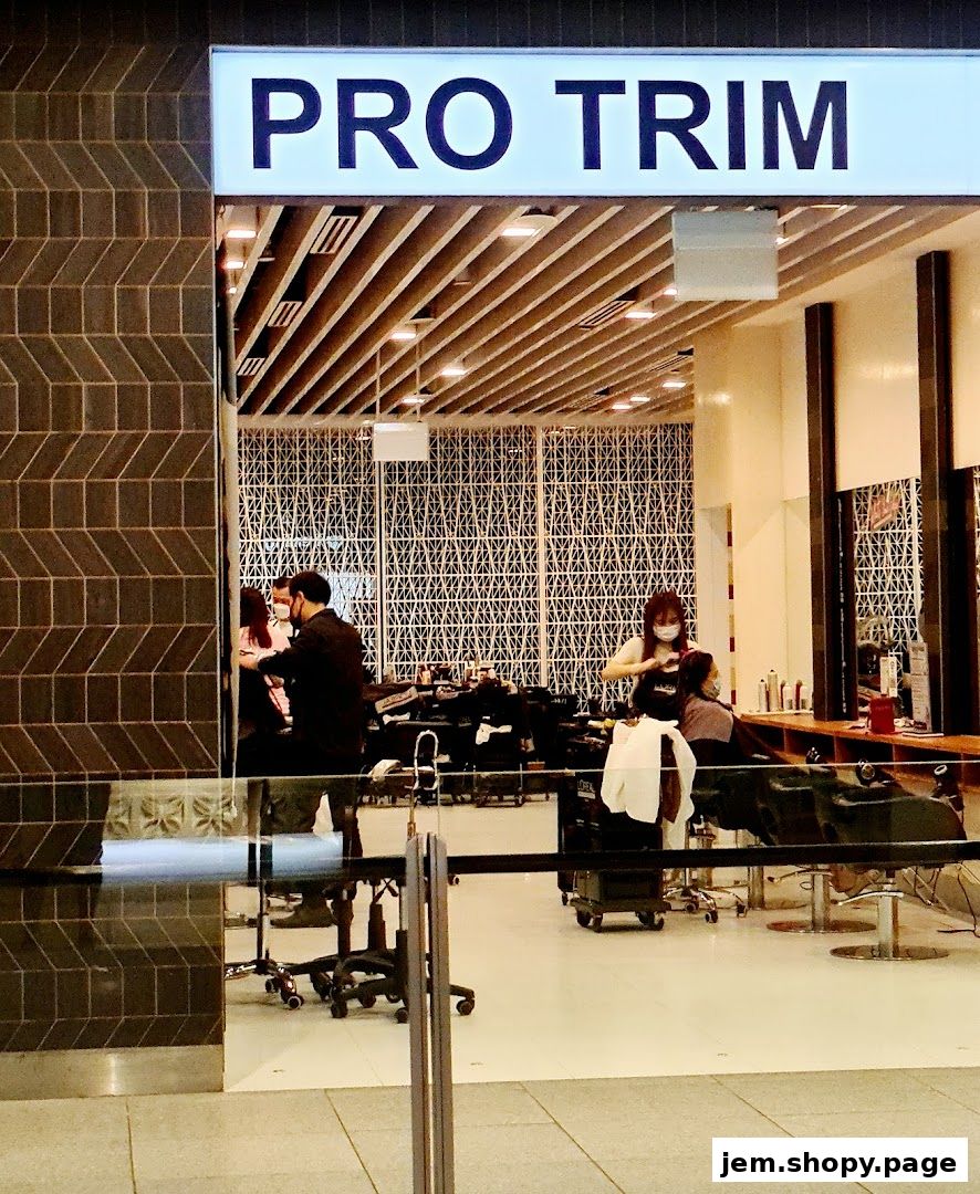 Exterior view of Pro Trim Hair Salon with stylists attending to clients inside.