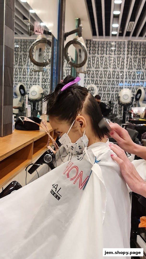 A person is getting their hair cut at Pro Trim Hair Salon, with vintage hair dryers in the background.